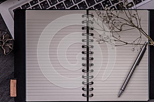 Open empty blank notebook organizer with pen for planning work on laptop. Concept for business, Planning or diary. Great for any