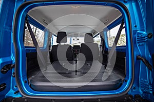 open empty car trunk with seats folded into flat flor of hatchback