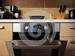 Open empty electric oven in home kitchen