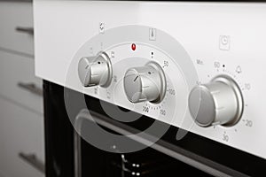 Open empty electric oven in kitchen
