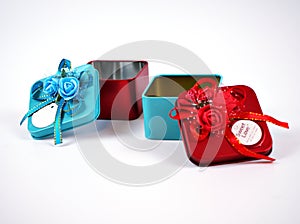 Open empty Gift box metal red and blue with ribbon isolated on white background