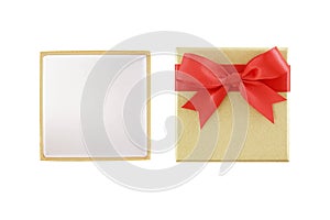 open empty luxury gold gift box with red ribbon bow isolated on white background