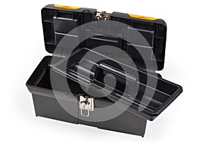 Open empty plastic portable multi-compartment toolbox with removed tray