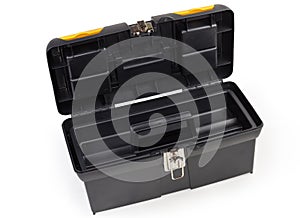 Open empty plastic portable multi-compartment toolbox on white background
