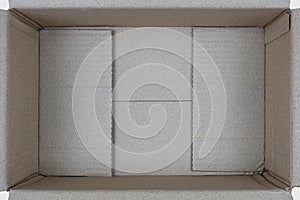 Open empty rectangular cardboard box on white background, Close up, Top view