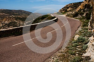 Open and empty winding road in Corsica