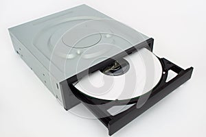 Open-ended CD - DVD drive with a black cap and disk inside.