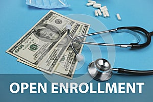 Open enrollment, medicine concept. Stethoscope, money and money on a green background