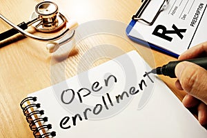 Open enrollment written on a note.