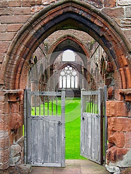 Sweetheart Abbey with Open Entrance Gate to the Ruins, New Abbey, Dumfries and Galloway, Scotland, Great Britain