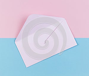 Open envelope on colored pink and blue background