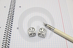 Open exercise book with mood dice (happy)