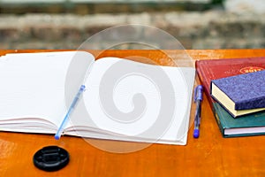 A open exercise book on a table.black