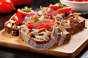 open-face pulled pork sandwich on whole-grain bread