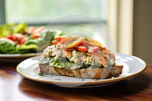 open-face salmon sandwich with mustard dill dressing