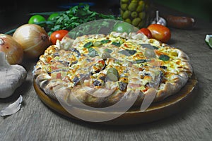 Open-faced filled edge italian pizza with olives