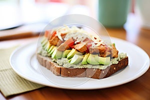 open-faced tempeh sandwich with avocado spread