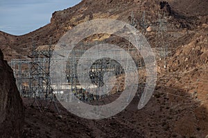 Open field dotted with power poles and crisscrossed with power lines