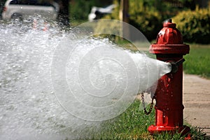 Open Fire Hydrant Gushing High Pressure Water photo