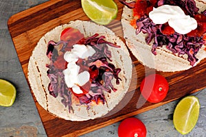 Open fish tacos with red cabbage lime slaw and salsa