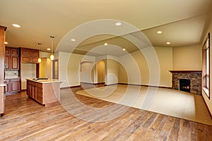 Open floor plan. Empty living room with carpet floor.