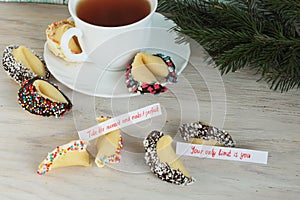 Open fortune cookie happy new year and tea