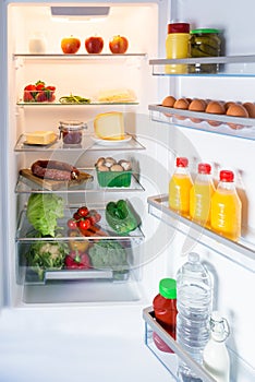 Open fridge filled with food