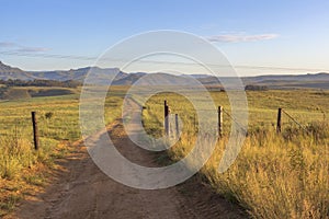 Open gate and farm road