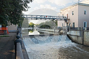 Open gateway on river in summer