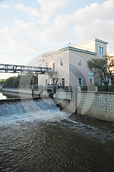 Open gateway on river in summer day