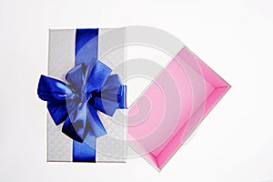 Open gift box with Blue ribbon on white background