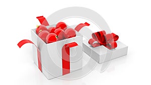 Open gift box with red ribbon full of Christmas balls