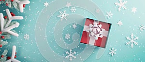 An open gift box is seen from the top. It is on a pastel blue background on a Christmas and New Year concept. This is a