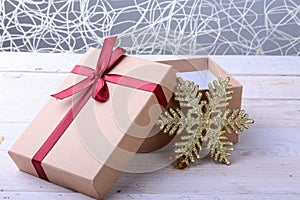 Open Gift boxes with bow on wood background. Christmas Decoration