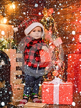 Open gift. Lovely baby enjoy christmas. Santa boy little child celebrate christmas at home. Childhood memories. Boy cute
