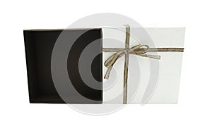 Open gift square box white and brown cross rope bow isolated on white background with clipping path single present for birthday an