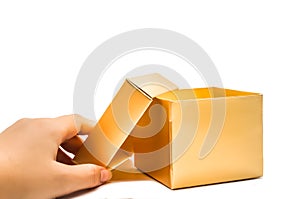 Open golden gift box hand hold