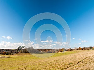 Open grass land farm agriculture plain blue sky above Wivenhoe