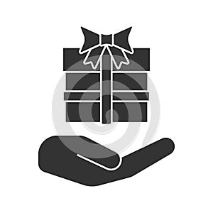 Open hand with gift box glyph icon