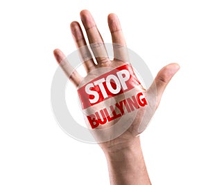 Open hand raised with the text: Stop Bullying isolated on white background