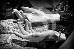 Open hands of the woman praying in the church