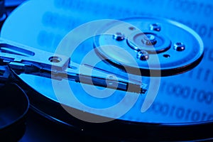 Open hard drive in blue light