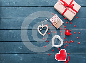 Open heart shape gift box with cookies over wooden background.