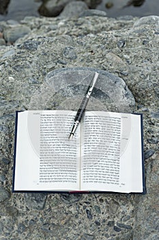 Open Hebrew Bible - TANAKH Torah, Neviim, Ketuvim - The Law, The Prophets, The Writings with fountain pen outdoors