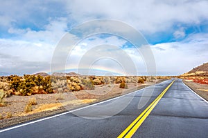 Open highway and rainbow