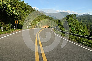 Open highway in scenic mountain landscape.
