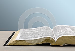 Open Holy bible book on background