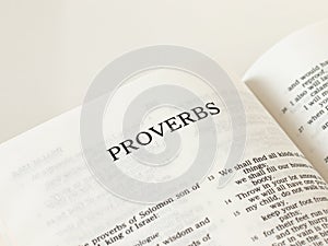 Open Holy Bible proverbs Book Old Testament Scripture on white background