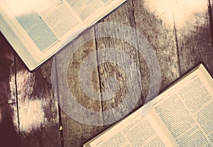 Open holy bible on wood table with sunlight.Sunday reading