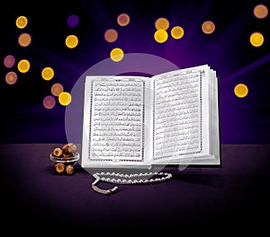 Open Holy Quran Book With Rosary and Dates